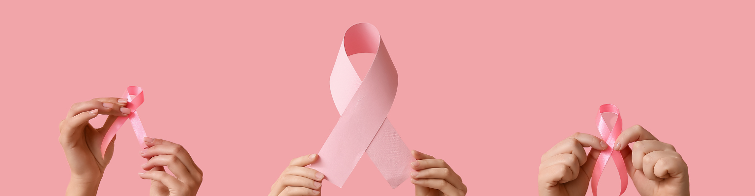 Breast Cancer Awareness Month ribbon being held up by many hands